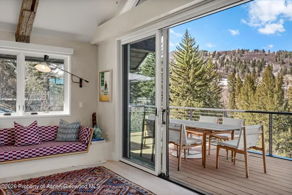 a view of a balcony with furniture