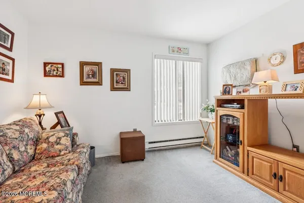 a view of a livingroom with washer and dryer