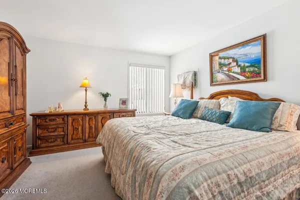 a bedroom with a bed and a cabinets