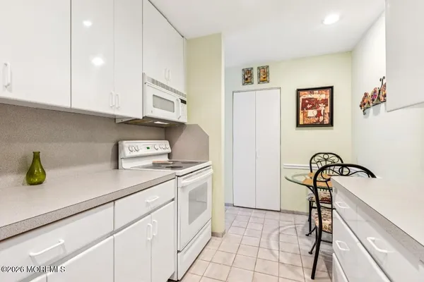 a kitchen with a sink and a stove top oven