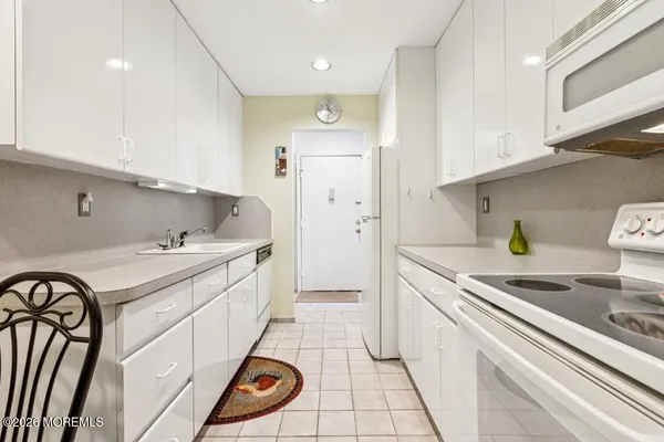 a bathroom with a sink mirror and vanity