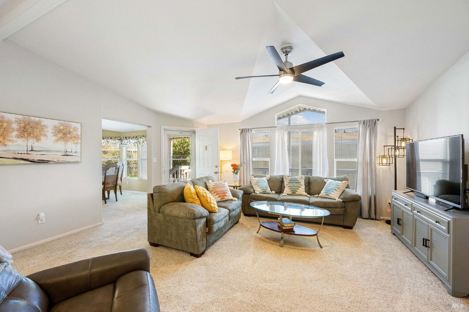 6468 Washington Street, Unit 16 Yountville, CA 94599 - Photo 13 of 45 a living room with furniture and a flat screen tv