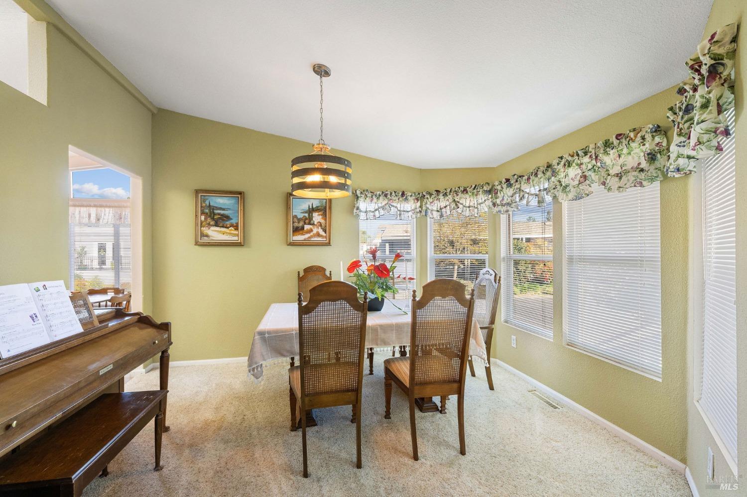 6468 Washington Street, Unit 16 Yountville, CA 94599 - Photo 14 of 45 a view of a dining room with furniture window and outside view