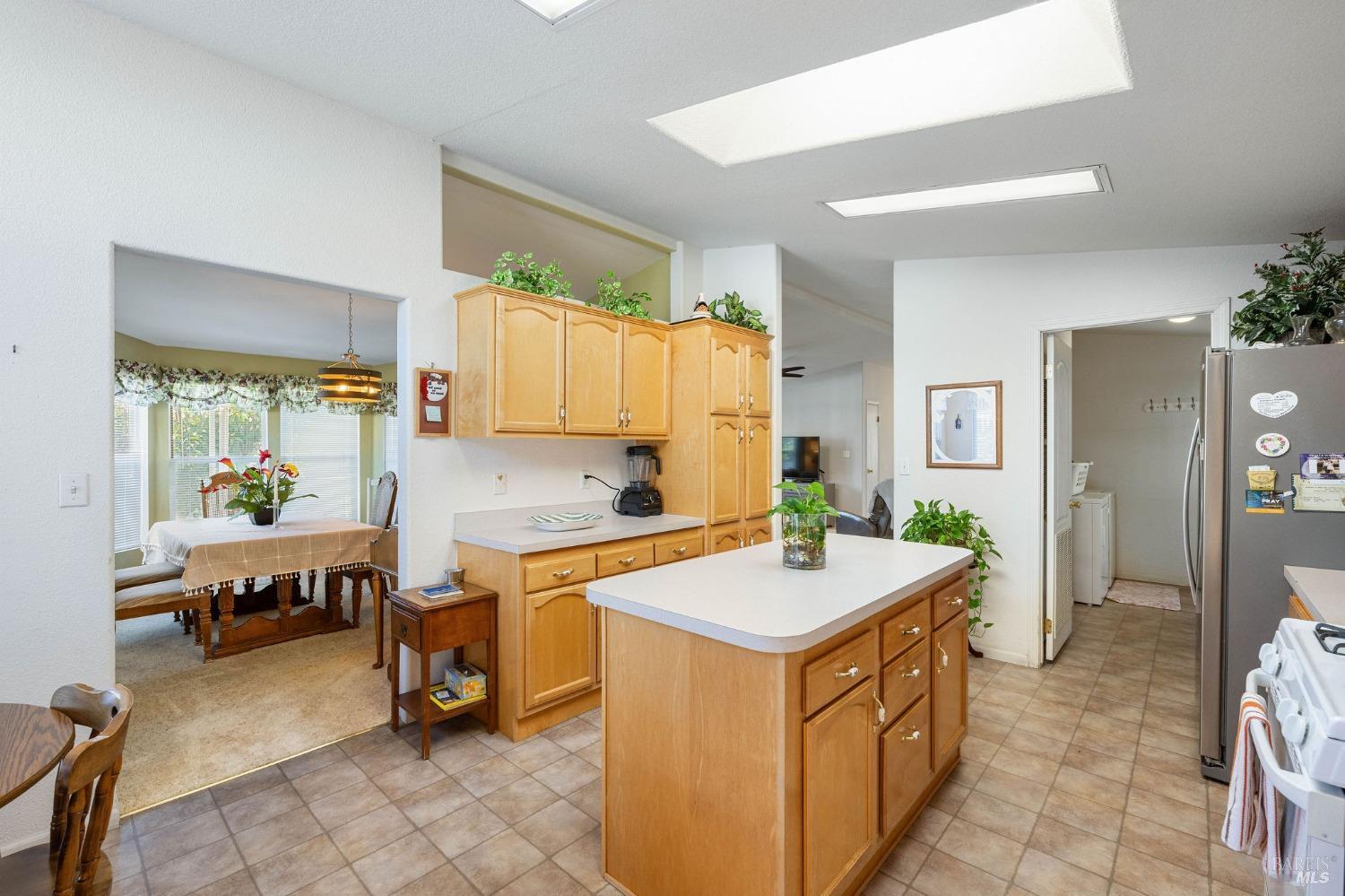 6468 Washington Street, Unit 16 Yountville, CA 94599 - Photo 19 of 45 a kitchen with a sink a counter top space and appliances