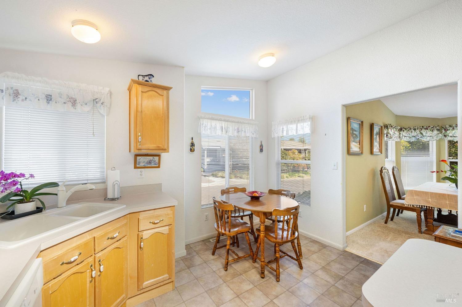 6468 Washington Street, Unit 16 Yountville, CA 94599 - Photo 20 of 45 a view of a kitchen area with furniture and wooden floor