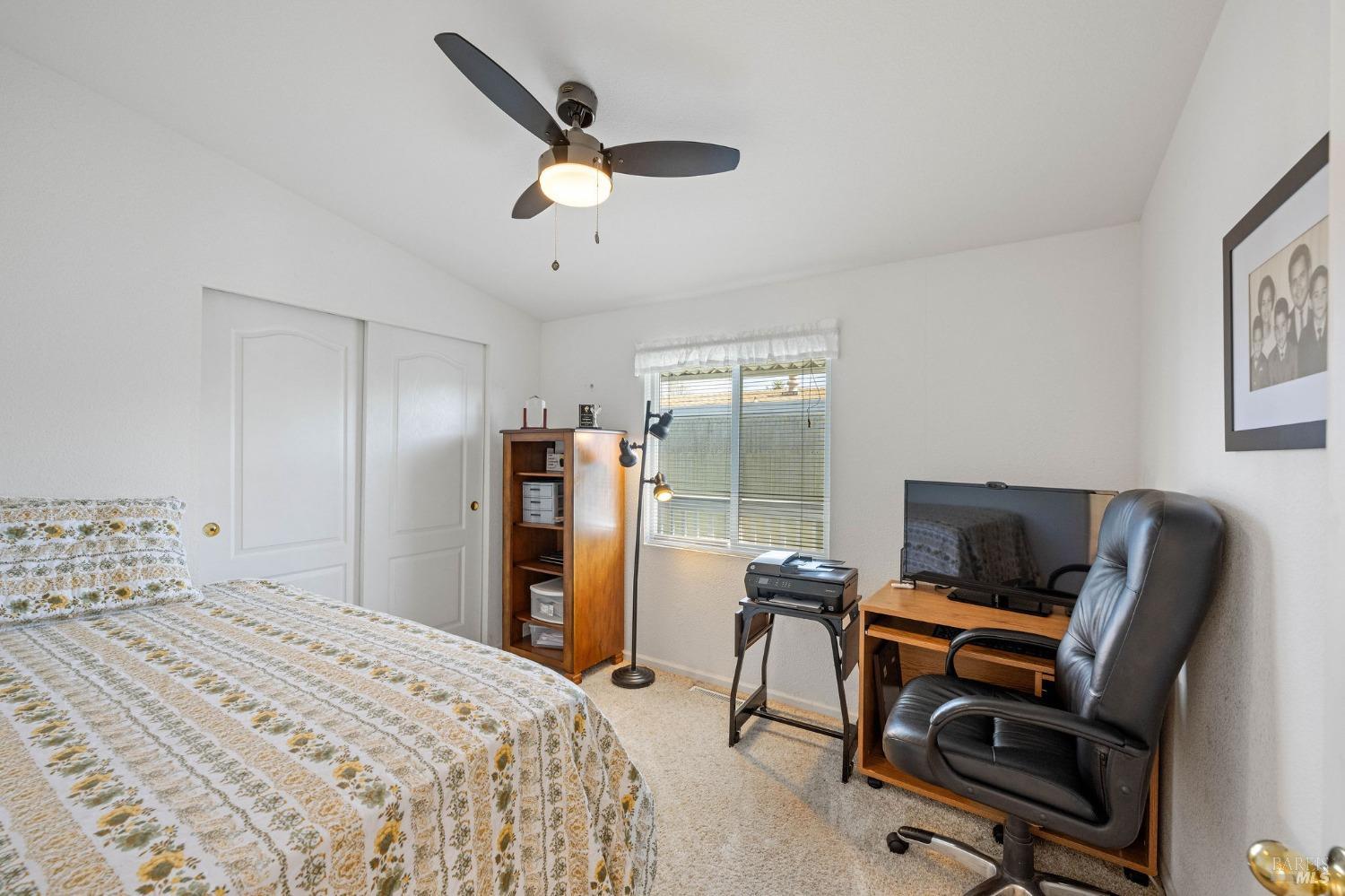 6468 Washington Street, Unit 16 Yountville, CA 94599 - Photo 30 of 45 a bedroom with a workspace