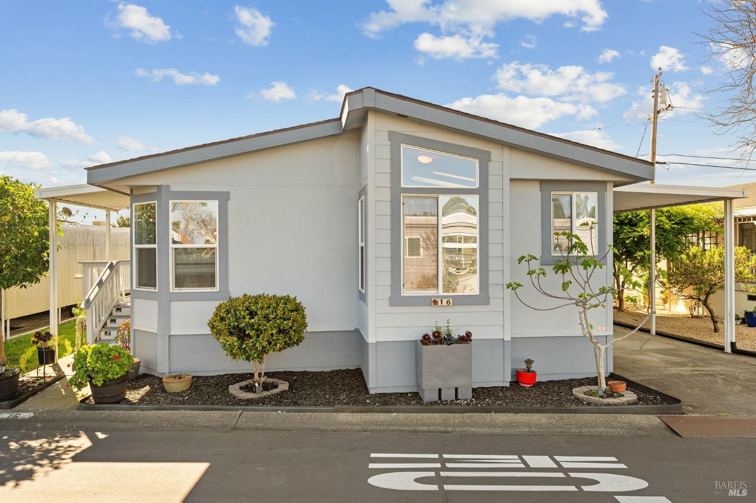 6468 Washington Street, Unit 16 Yountville, CA 94599 - Photo 3 of 45 a front view of a house with a garden