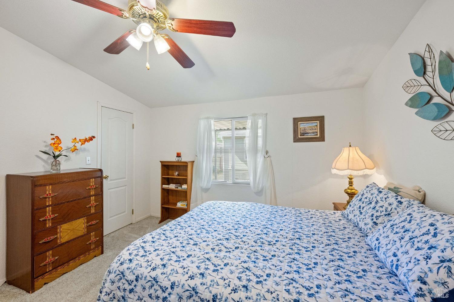 6468 Washington Street, Unit 16 Yountville, CA 94599 - Photo 33 of 45 a bedroom with a bed and a dresser