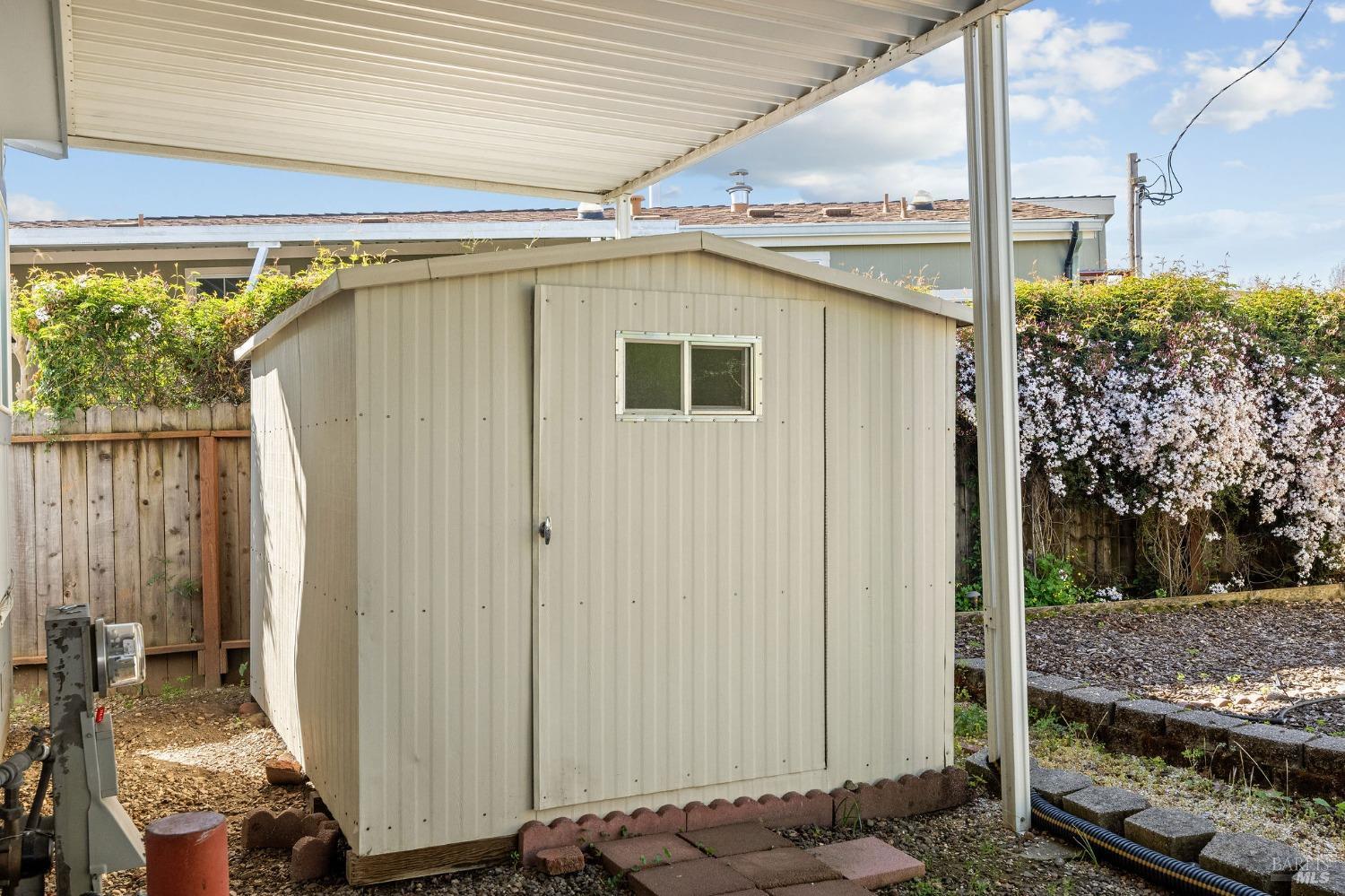 6468 Washington Street, Unit 16 Yountville, CA 94599 - Photo 34 of 45 a view of a house with a backyard