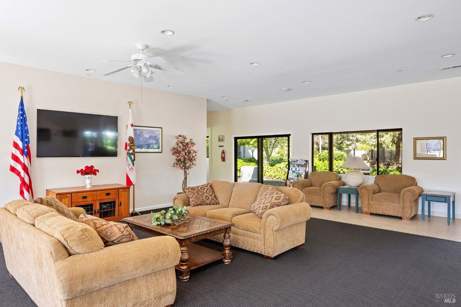 6468 Washington Street, Unit 16 Yountville, CA 94599 - Photo 40 of 45 a living room with furniture and a flat screen tv