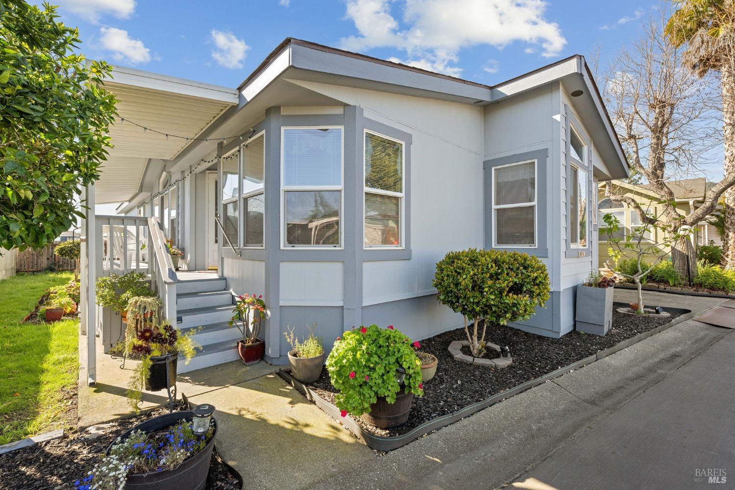 6468 Washington Street, Unit 16 Yountville, CA 94599 - Photo 4 of 45 a front view of a house with a yard