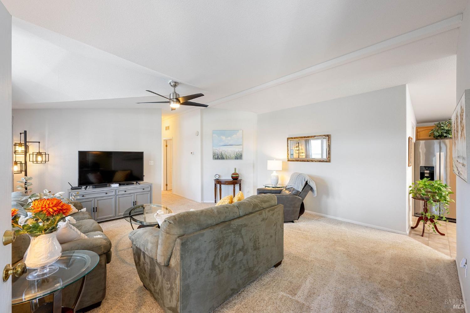 6468 Washington Street, Unit 16 Yountville, CA 94599 - Photo 8 of 45 a living room with furniture and a flat screen tv