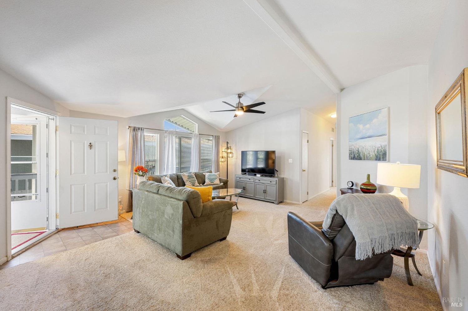 6468 Washington Street, Unit 16 Yountville, CA 94599 - Photo 9 of 45 a living room with furniture and a large window