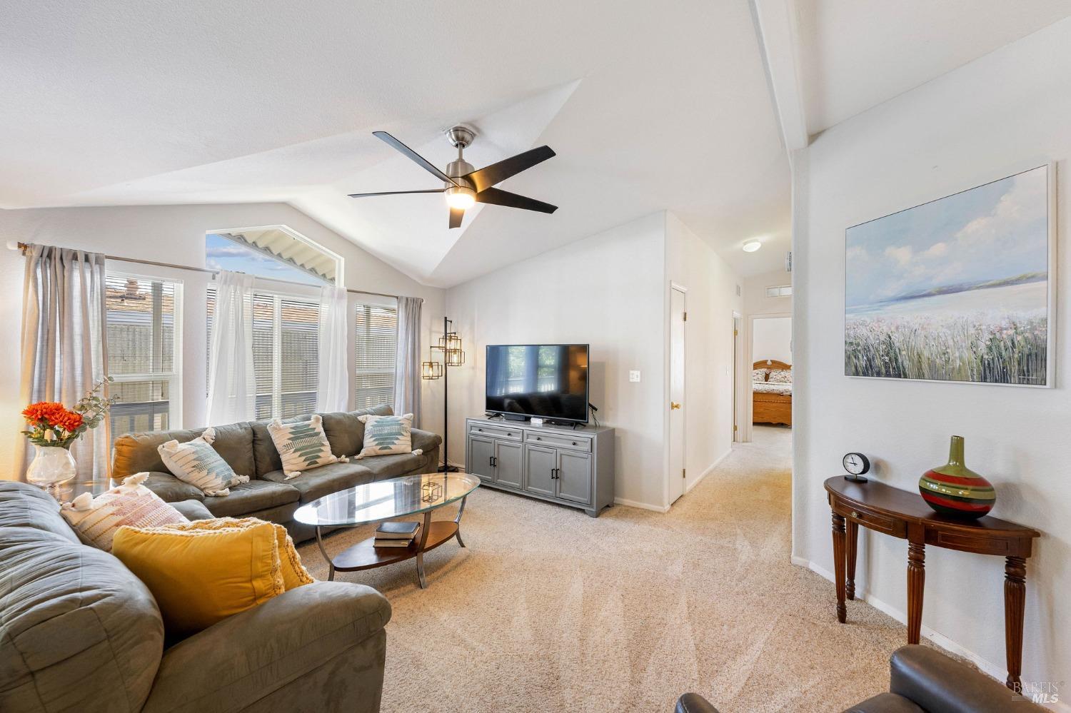 6468 Washington Street, Unit 16 Yountville, CA 94599 - Photo 10 of 45 a living room with furniture and a flat screen tv