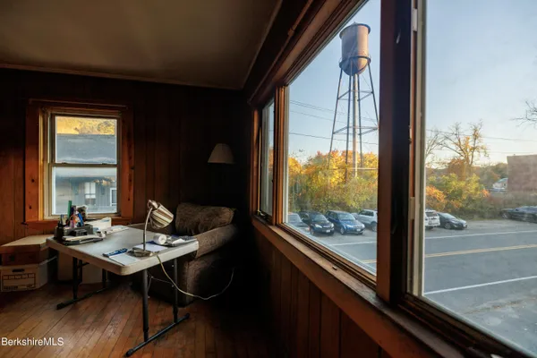 a living room with furniture and a lamp