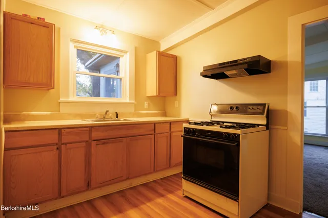 a bathroom with a granite countertop window and a door