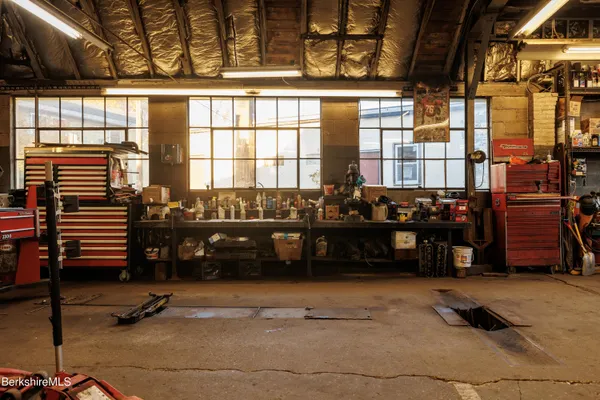 a view of a livingroom with furniture and staircase