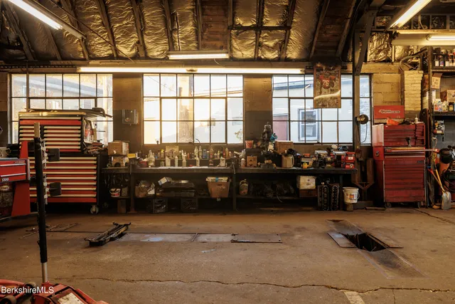 a view of a livingroom with furniture and staircase