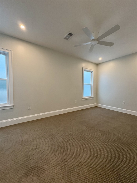 54 Falcon Street, Unit 2 Boston, MA 02128 - Photo 11 of 21 an empty room with a empty space and windows