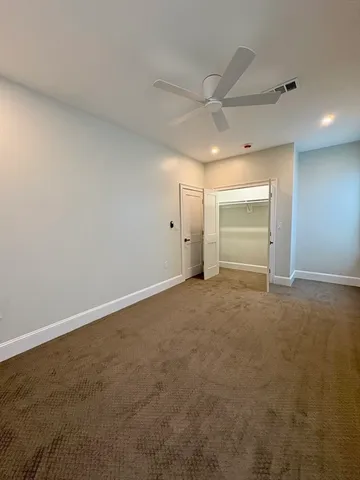 an empty room with an empty space and wooden floor