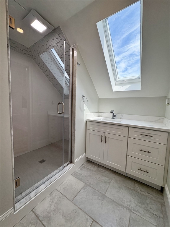 54 Falcon Street, Unit 2 Boston, MA 02128 - Photo 17 of 21 a bathroom with a shower sink and mirror