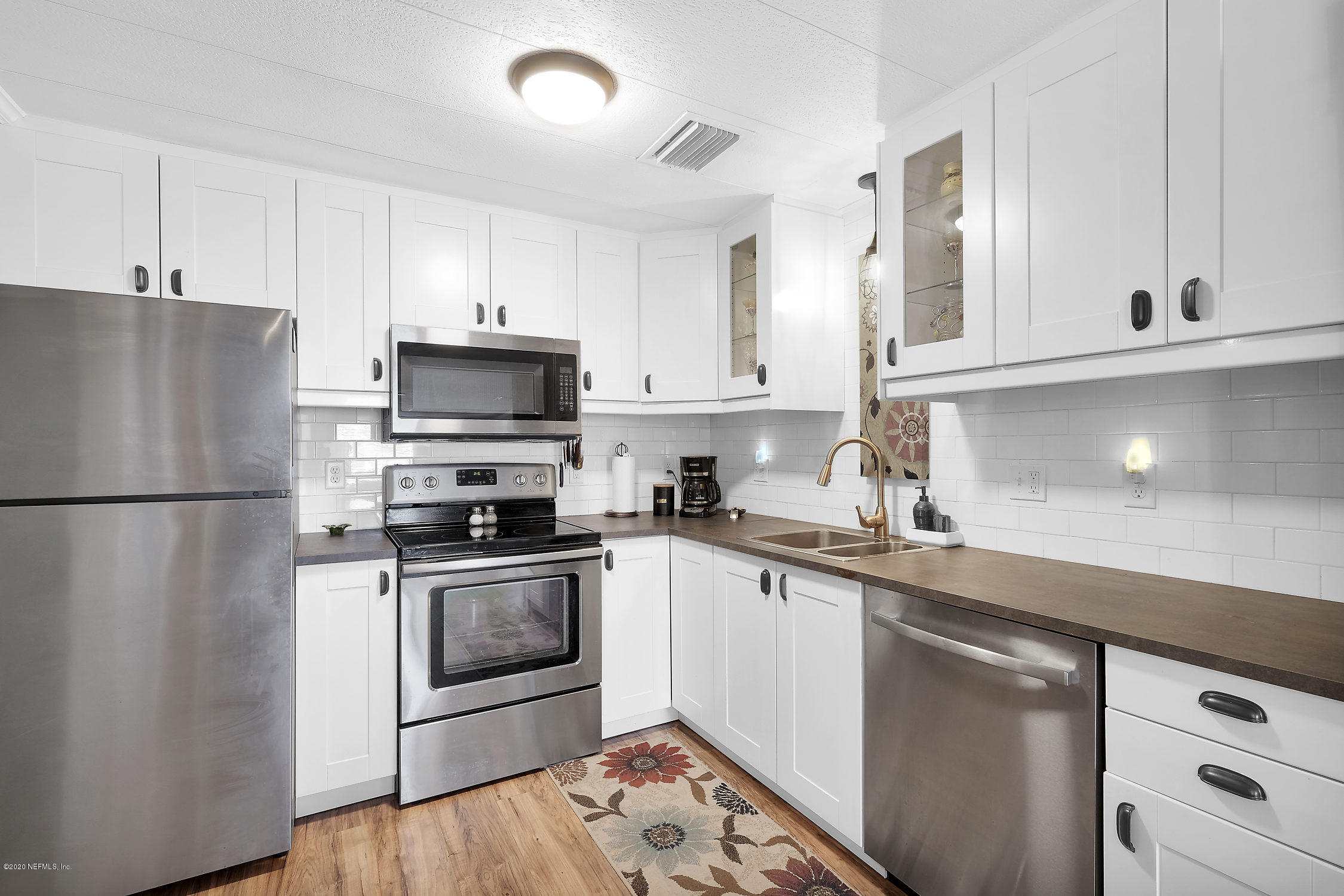 890 Palermo Road St. Augustine, FL 32086 - Photo 1 of 25 a kitchen with stainless steel appliances granite countertop a refrigerator sink and stove