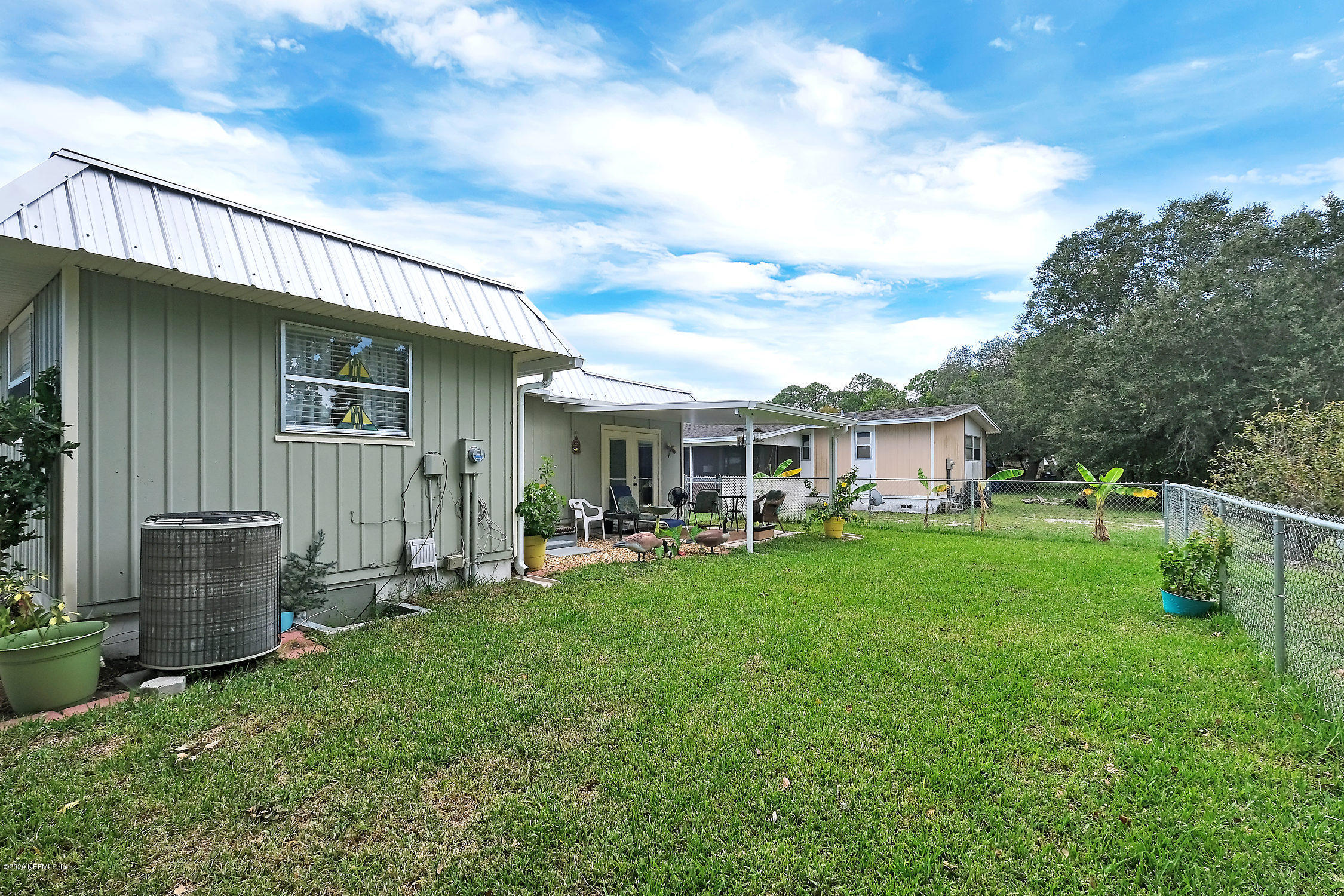890 Palermo Road St. Augustine, FL 32086 - Photo 21 of 25 a house view with a garden space