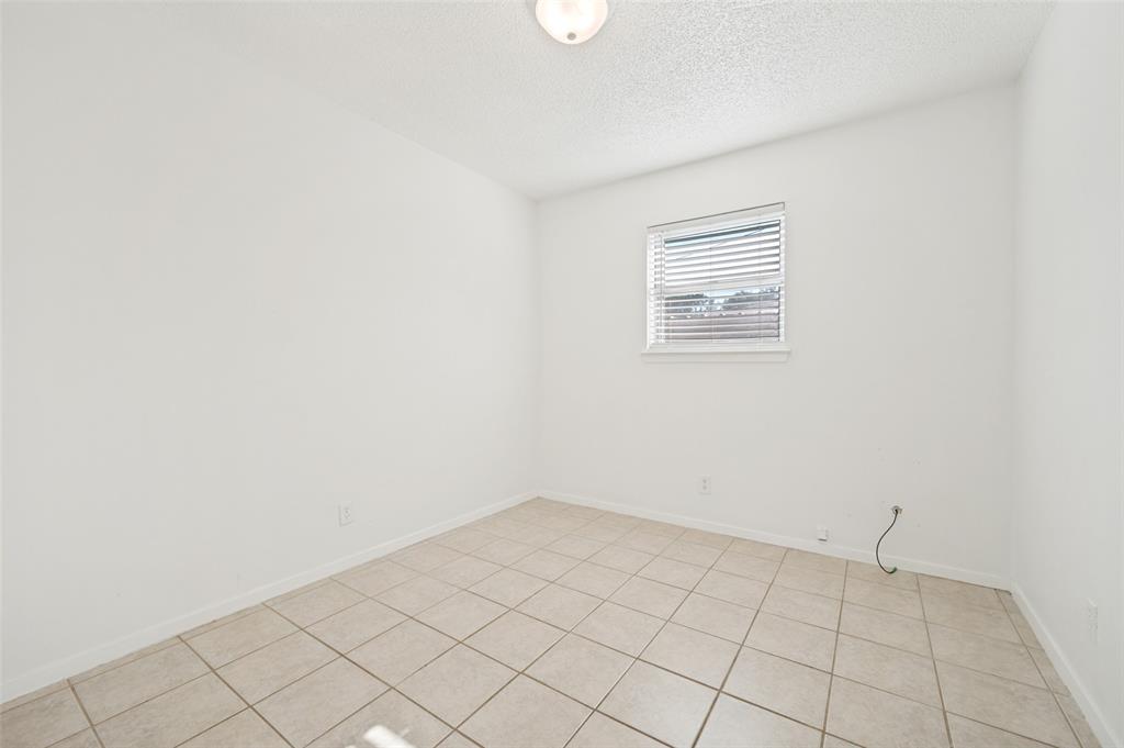 709 East Main Street Pilot Point, TX 76258 - Photo 9 of 11 an empty room with windows