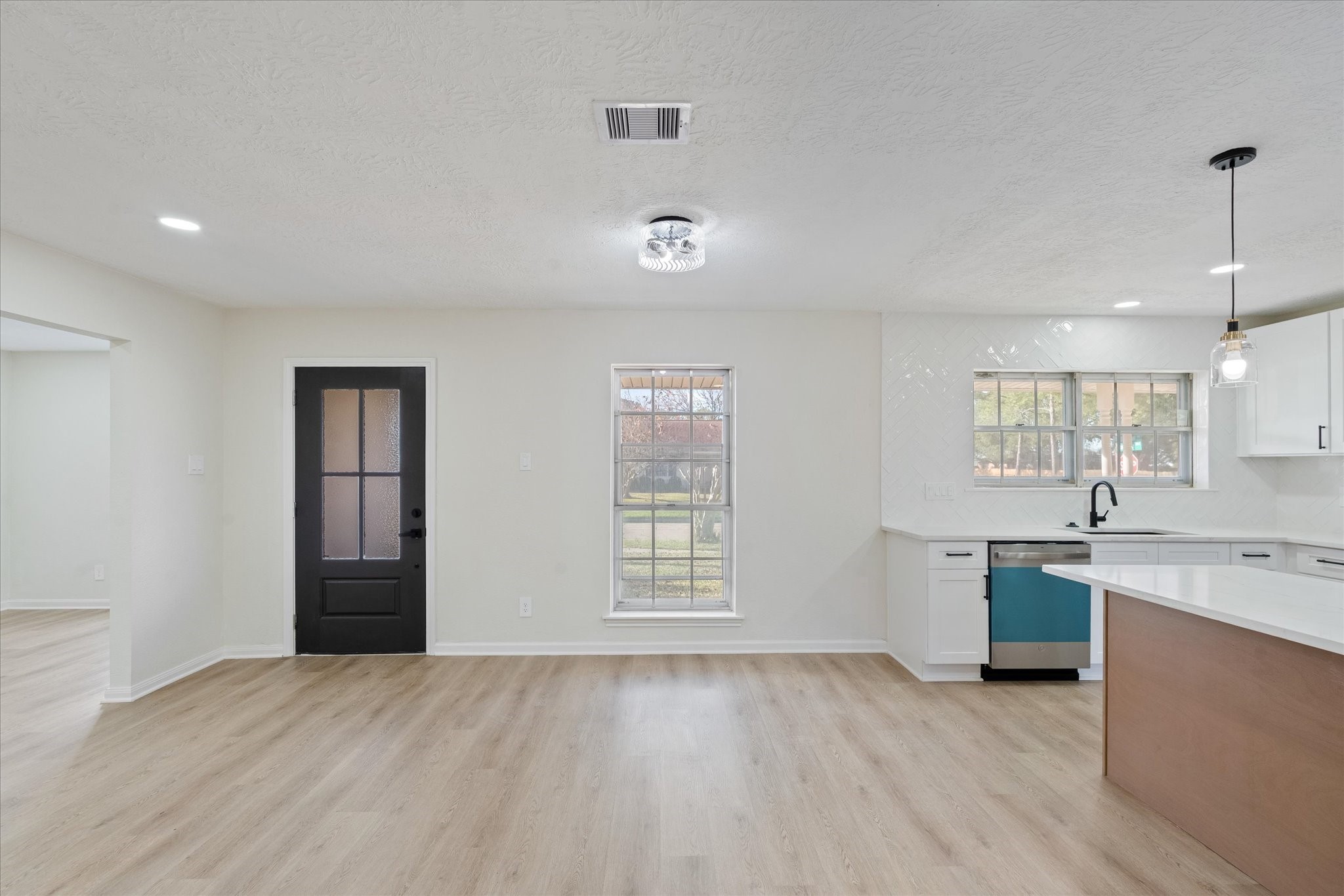 10403 Winding Trail Road La Porte, TX 77571 - Photo 12 of 26 a view of a kitchen with stainless steel appliances granite countertop a sink and wooden floor
