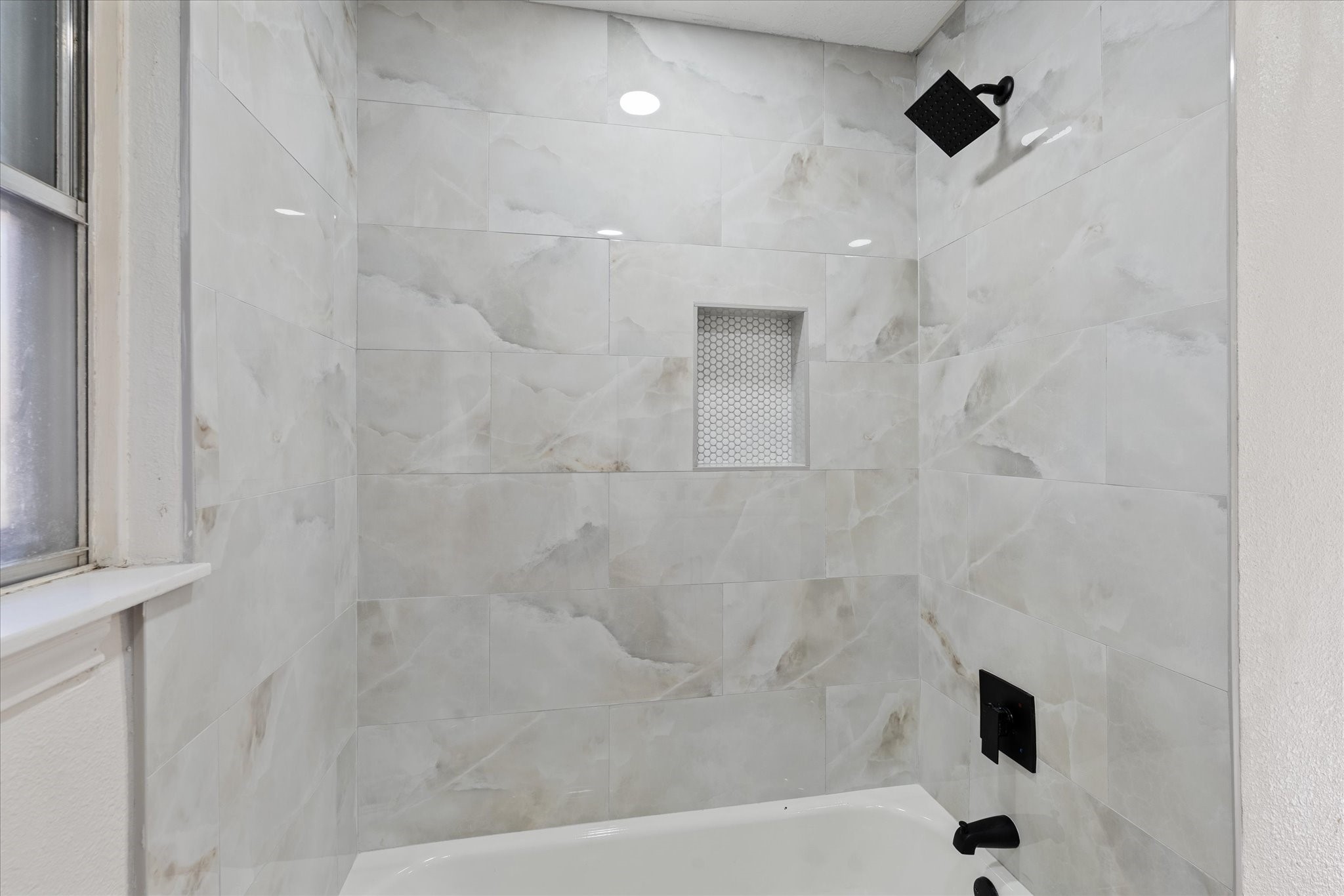 10403 Winding Trail Road La Porte, TX 77571 - Photo 16 of 26 a bathroom with a shower and a bathtub