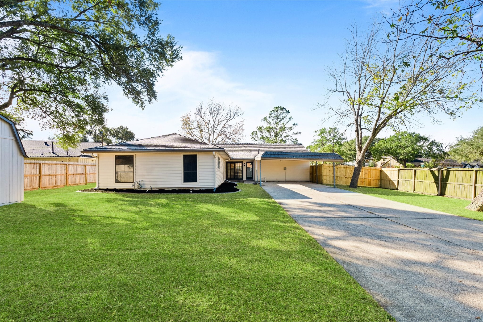 10403 Winding Trail Road La Porte, TX 77571 - Photo 26 of 26 a view of a yard in front of a house with large trees