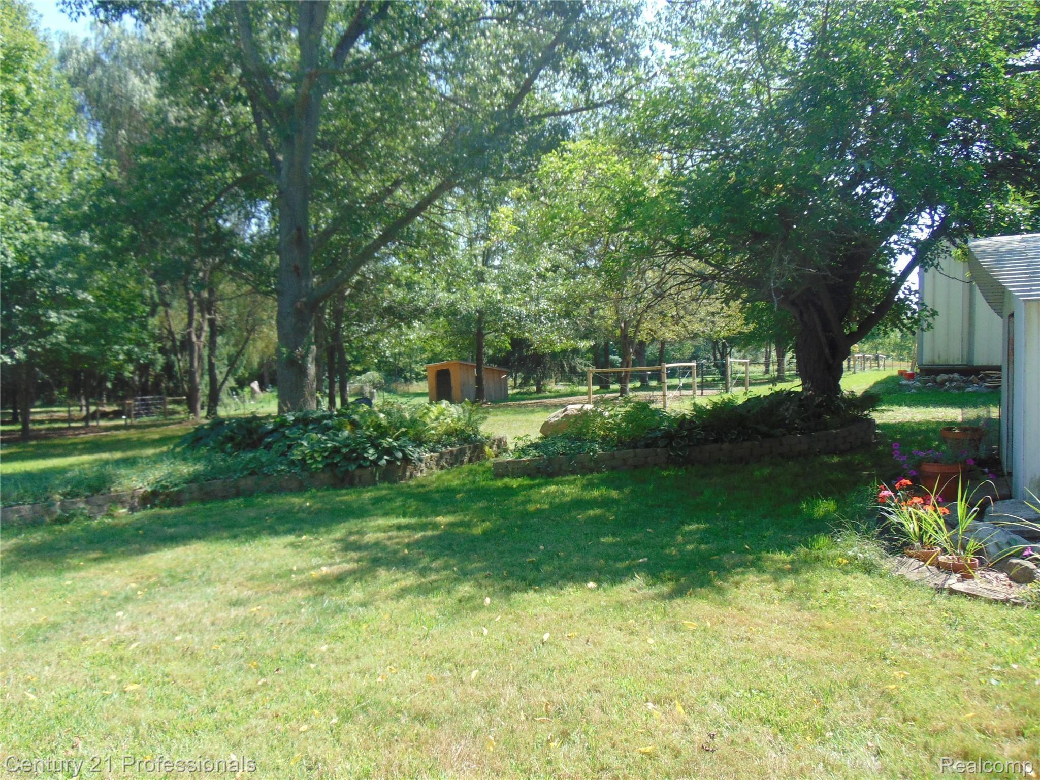 7222 Tucker Road Holly, MI 48442 - Photo 25 of 36 Backyard has Plenty of Open Space & Mature Trees.....