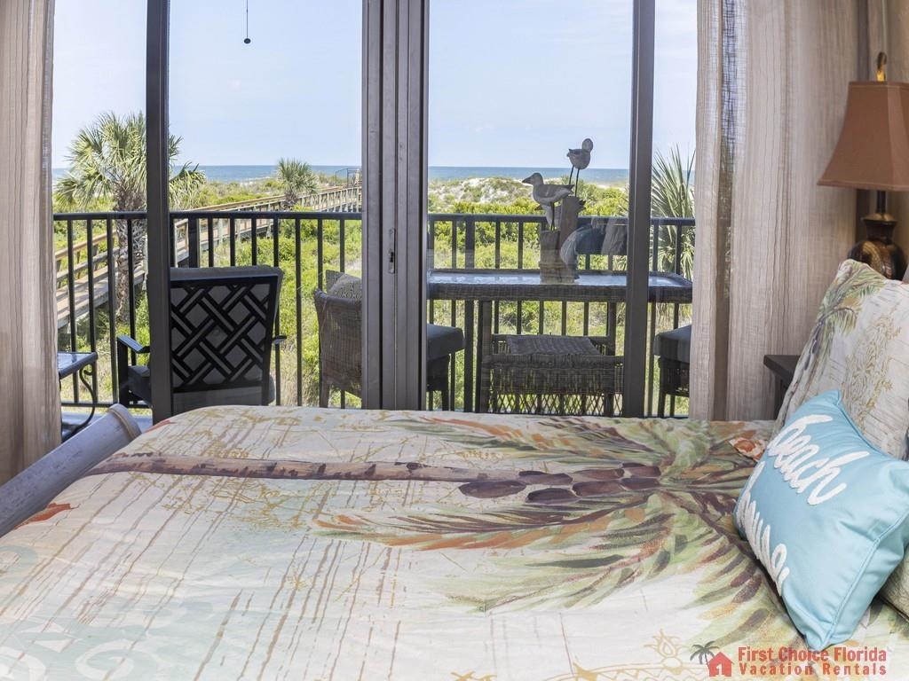 1 Dondanville Road, Unit 109B St. Augustine, FL 32080 - Photo 12 of 27 a bedroom with a bed and a large window