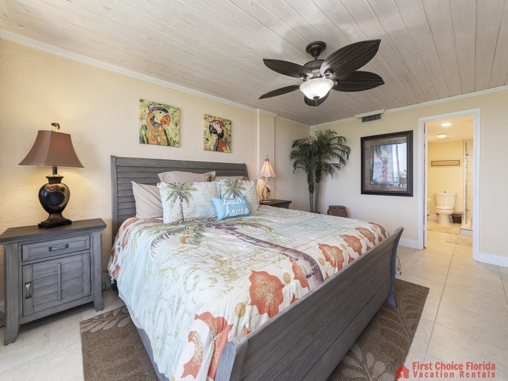 1 Dondanville Road, Unit 109B St. Augustine, FL 32080 - Photo 13 of 27 a bedroom with a large bed and a chandelier