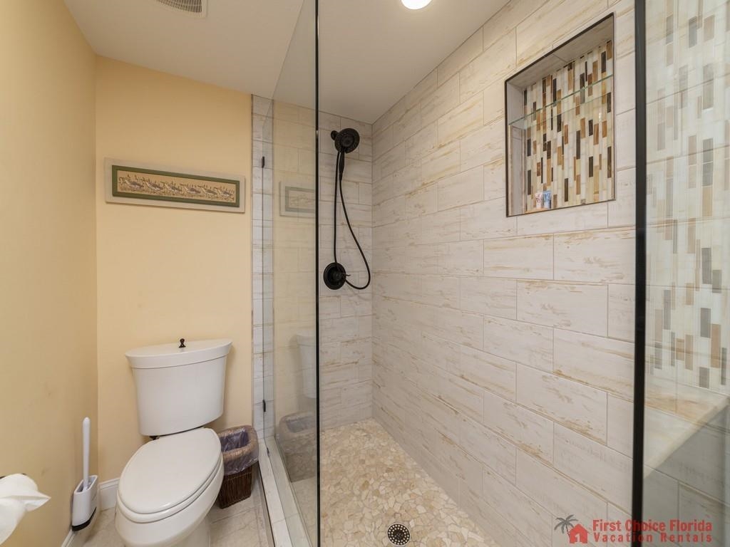 1 Dondanville Road, Unit 109B St. Augustine, FL 32080 - Photo 16 of 27 a white toilet sitting next to a bathroom sink