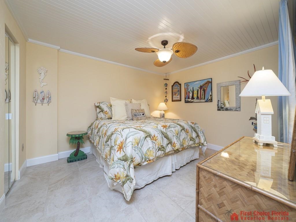 1 Dondanville Road, Unit 109B St. Augustine, FL 32080 - Photo 17 of 27 a bedroom with a bed and a chandelier