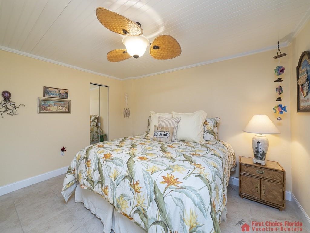 1 Dondanville Road, Unit 109B St. Augustine, FL 32080 - Photo 18 of 27 a bedroom with bed and a chandelier