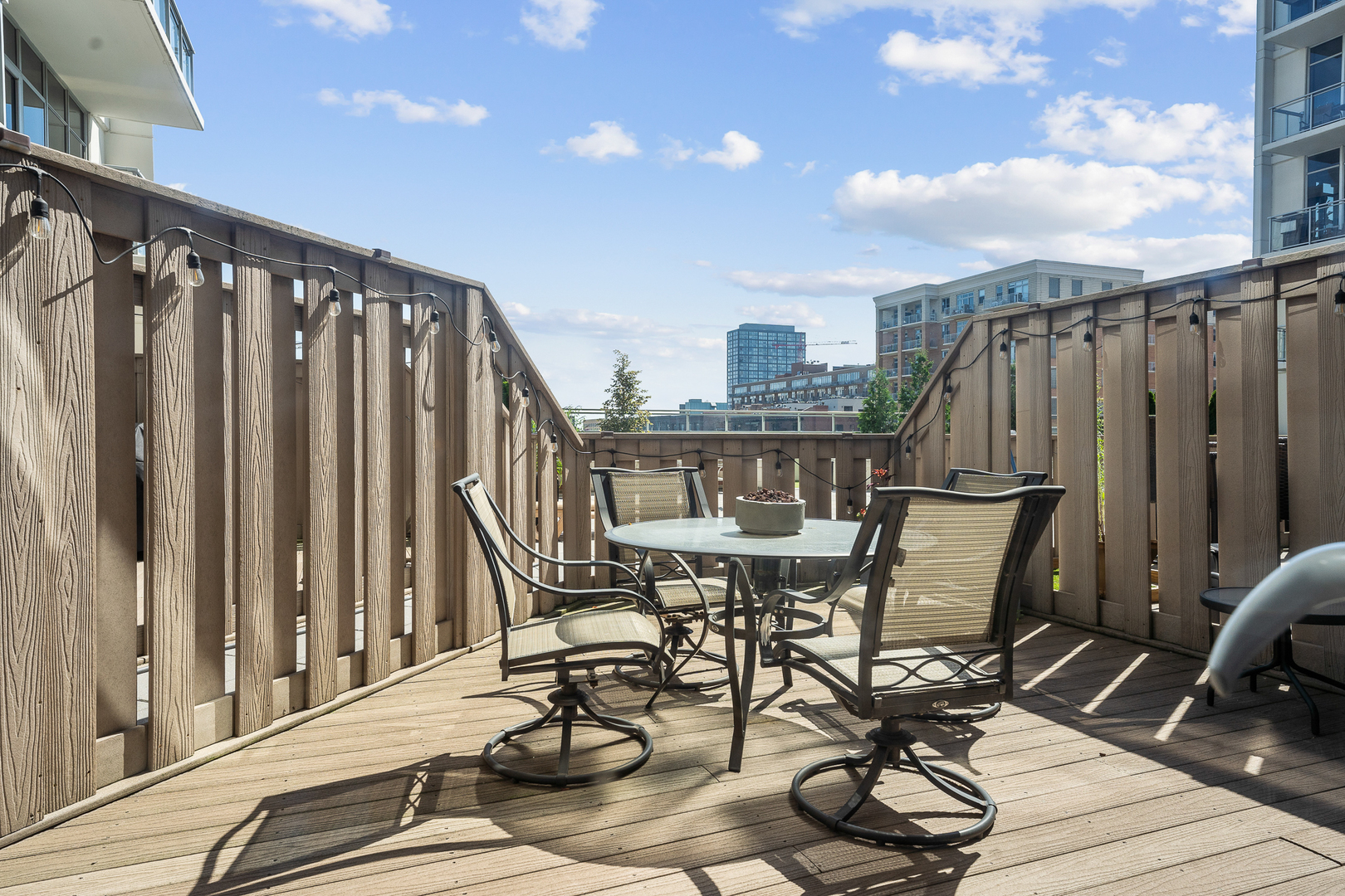 901 West Madison Street, Unit 401 Chicago, IL 60607 - Photo 13 of 19 a view of balcony with chairs and wooden fence