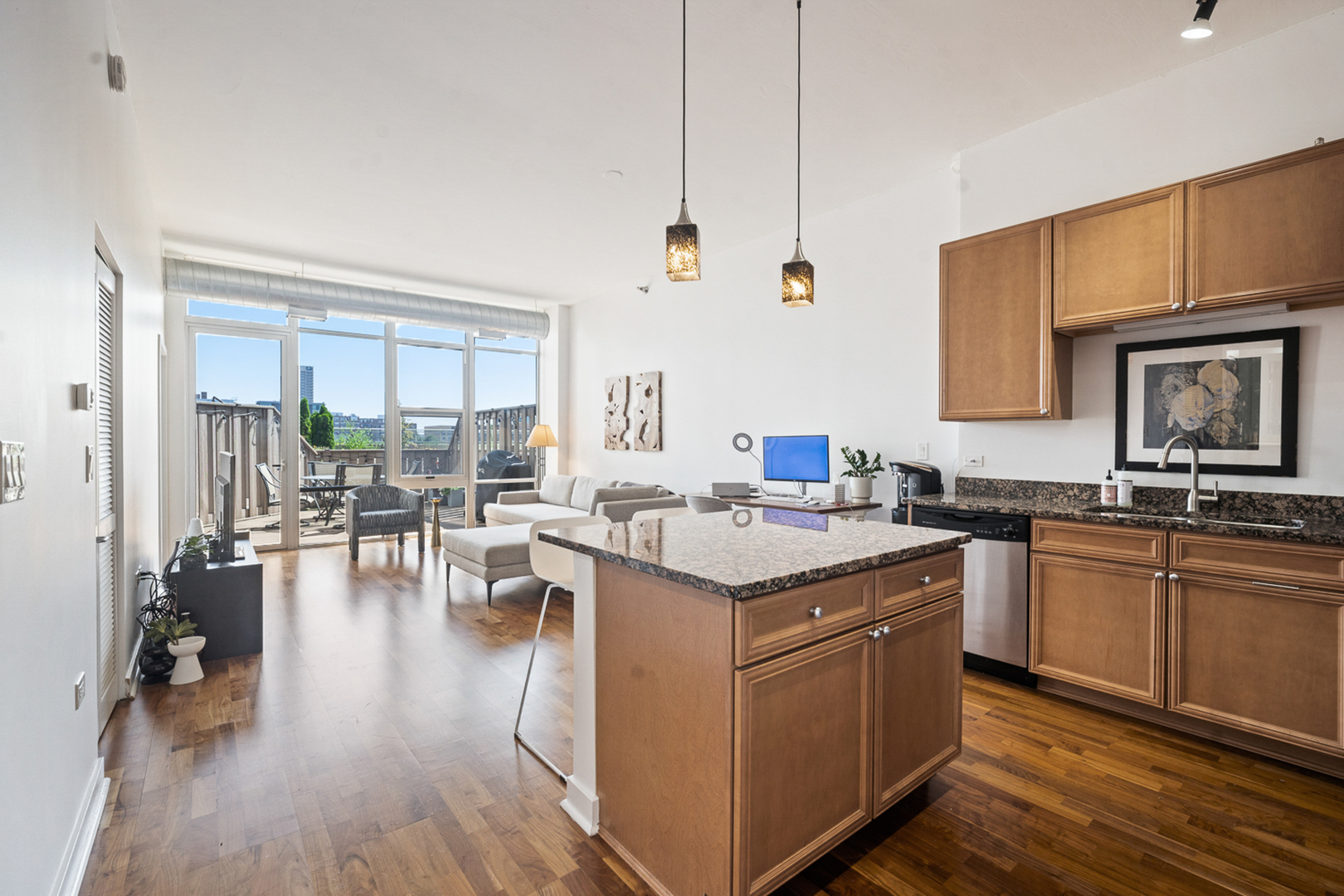 901 West Madison Street, Unit 401 Chicago, IL 60607 - Photo 6 of 19 a kitchen with a sink stove and wooden cabinets