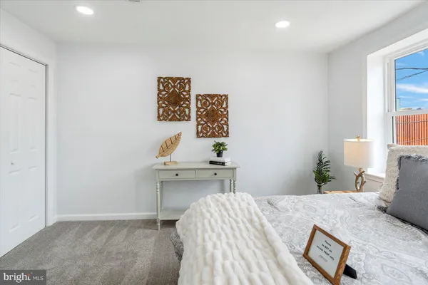 a bedroom with a bed and a table