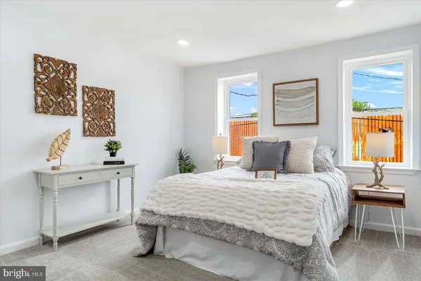 a bedroom with a bed and a table in it