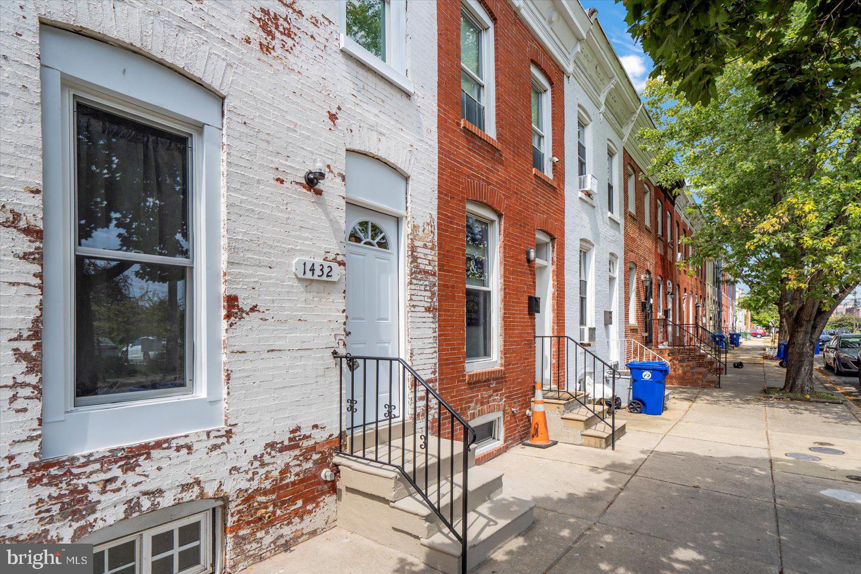 1432 Carroll Street Baltimore, MD 21230 - Photo 2 of 29 city view of a brick buildings with many windows