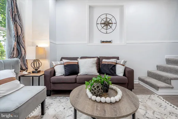 a living room with furniture and a table