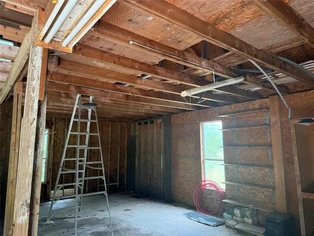 a view of an empty room with a garage