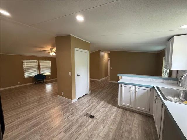 a bathroom with a sink and a large mirror
