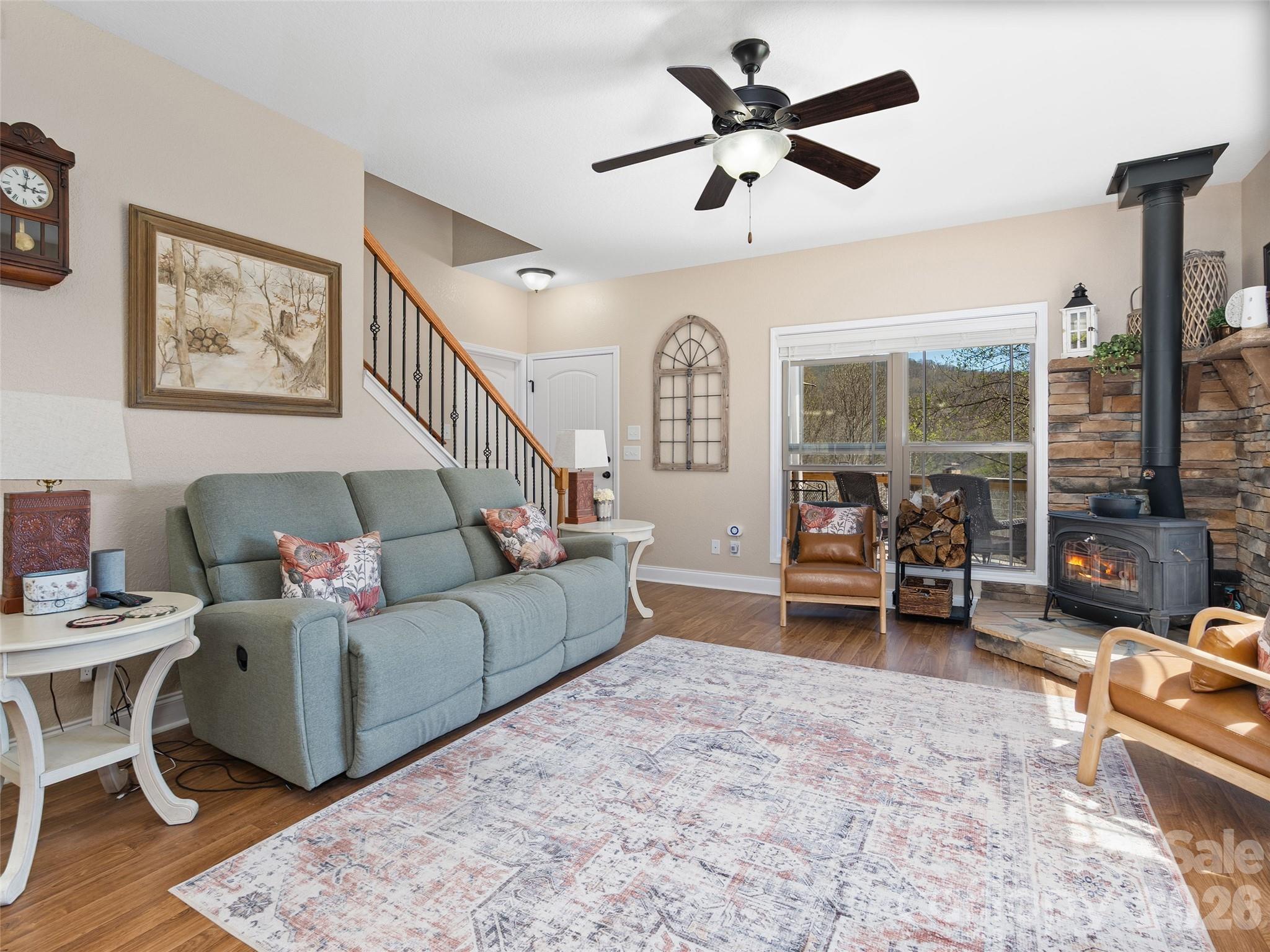 4823 Max Patch Road Clyde, NC 28721 - Photo 12 of 32 a living room with furniture and a large window