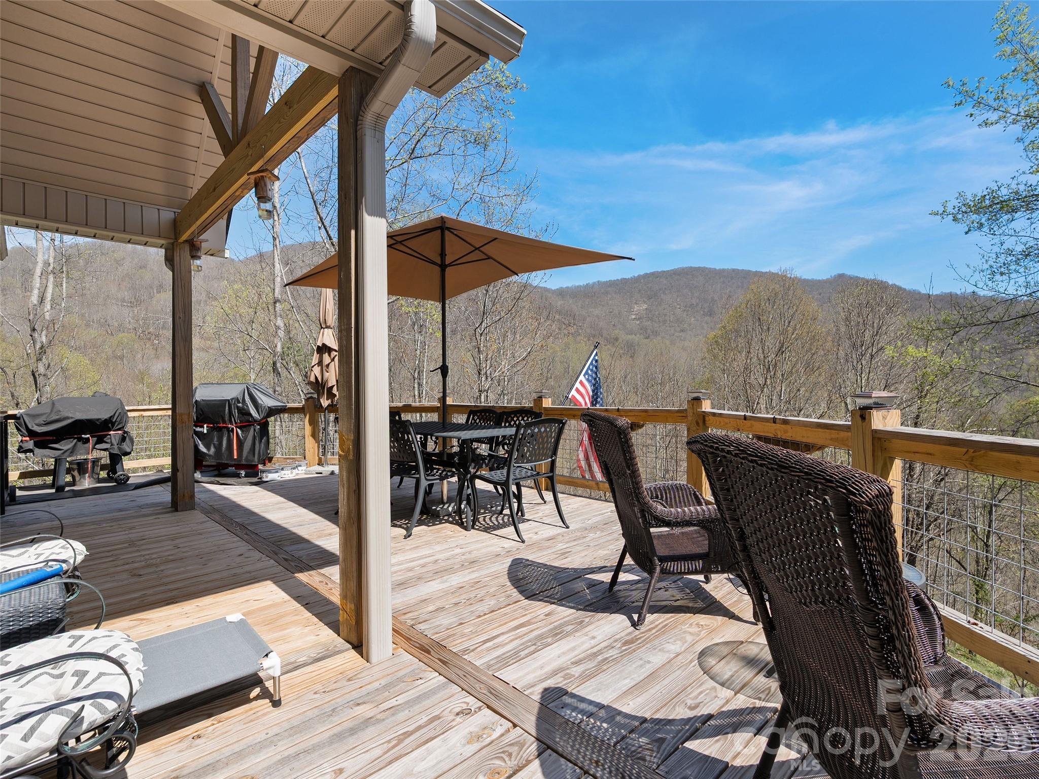 4823 Max Patch Road Clyde, NC 28721 - Photo 13 of 32 a view of chair and tables in the patio