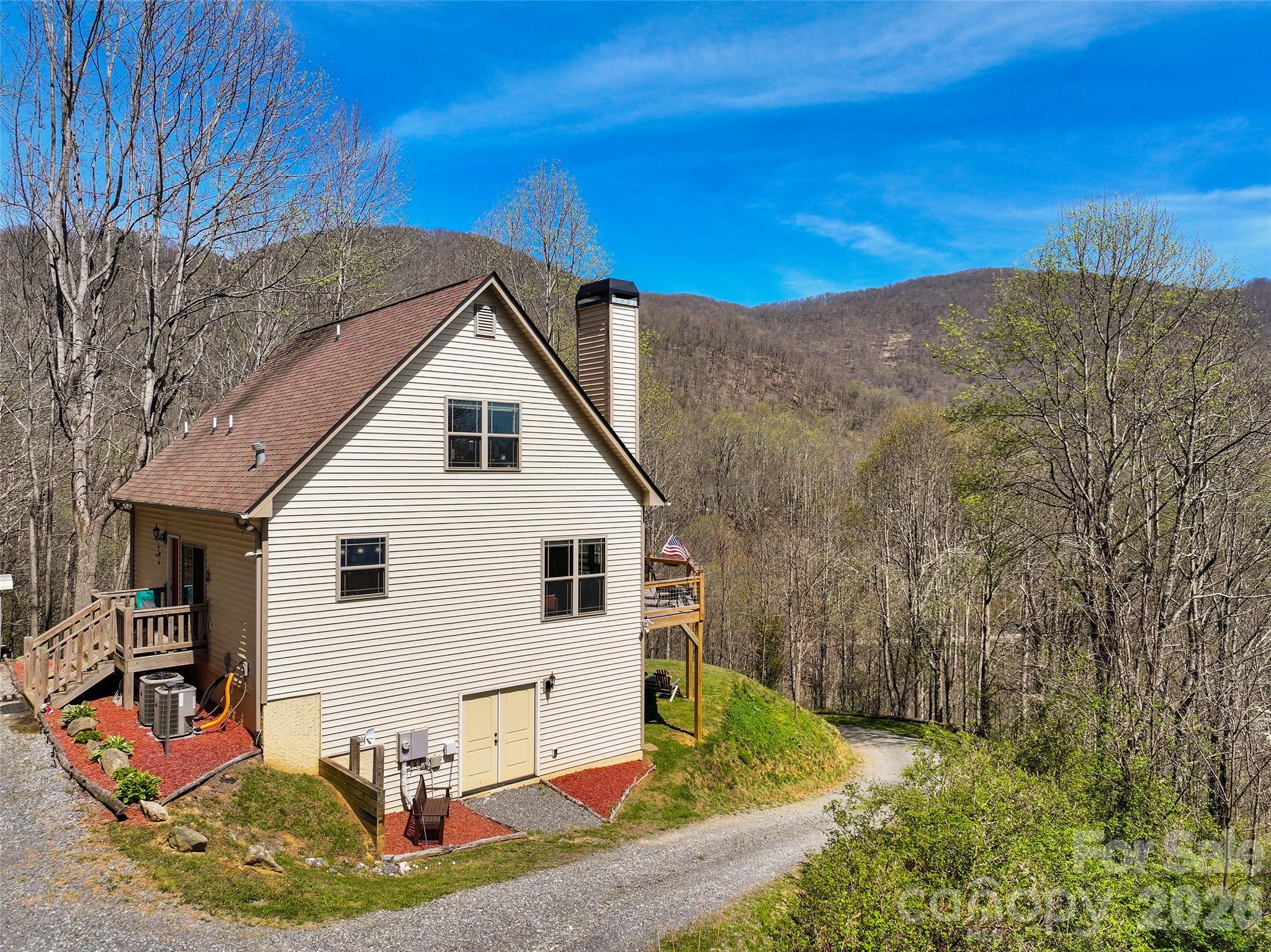 4823 Max Patch Road Clyde, NC 28721 - Photo 2 of 32 a view of a house with a backyard