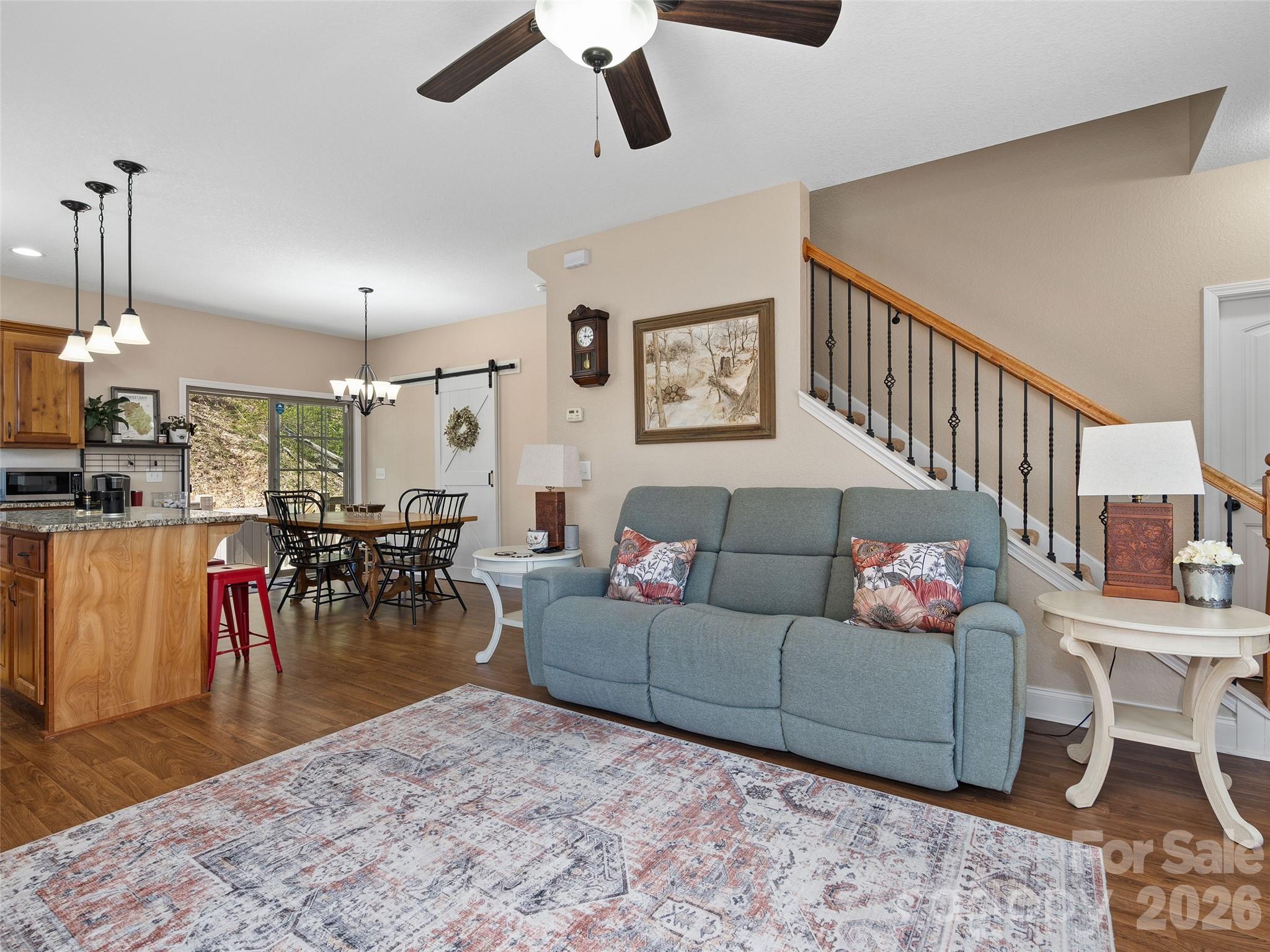 4823 Max Patch Road Clyde, NC 28721 - Photo 10 of 32 a living room with furniture and a dining table