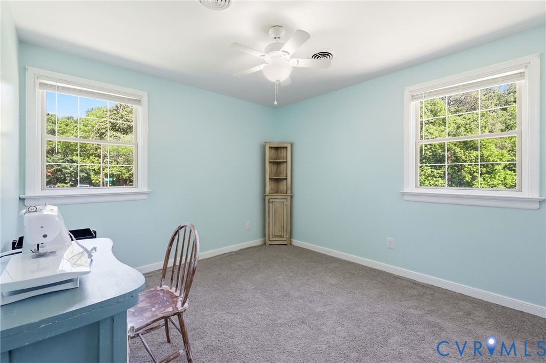 11200 Surry Road Chester, VA 23831 - Photo 29 of 48 a view of a workspace with furniture and a window